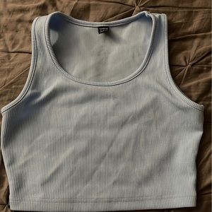 I am selling a baby blue crop top shirt.